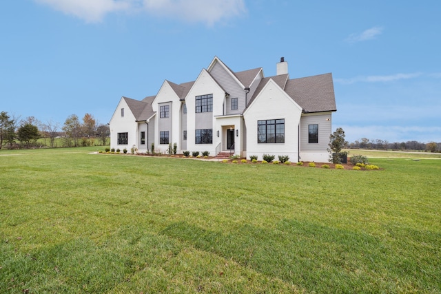 view of front of home with a front lawn