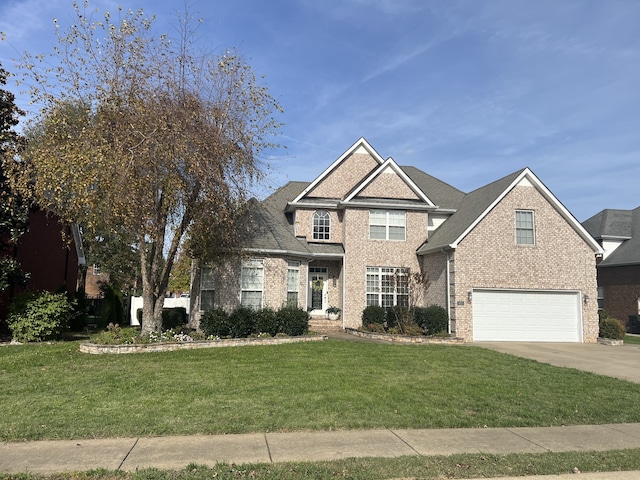 view of front of house with a front yard and a garage