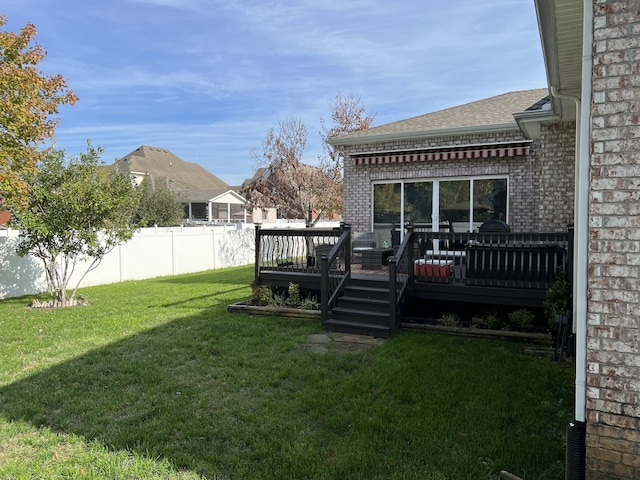 view of yard with a wooden deck