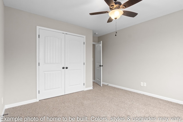 unfurnished bedroom with ceiling fan, light colored carpet, and a closet