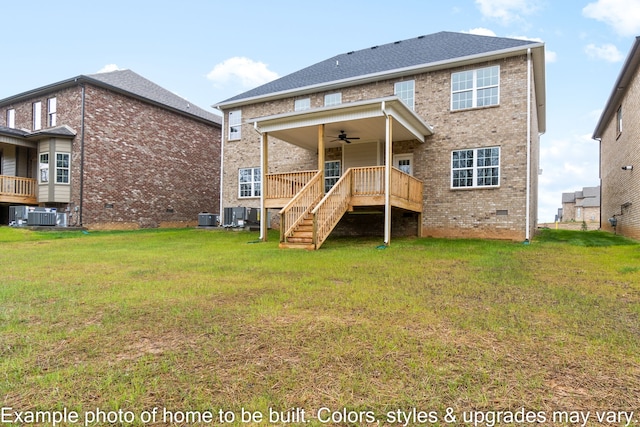 back of house featuring central AC, ceiling fan, and a yard