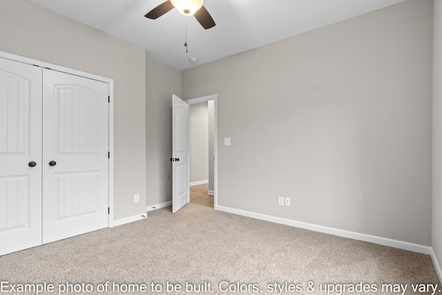 unfurnished bedroom with light colored carpet, a closet, and ceiling fan