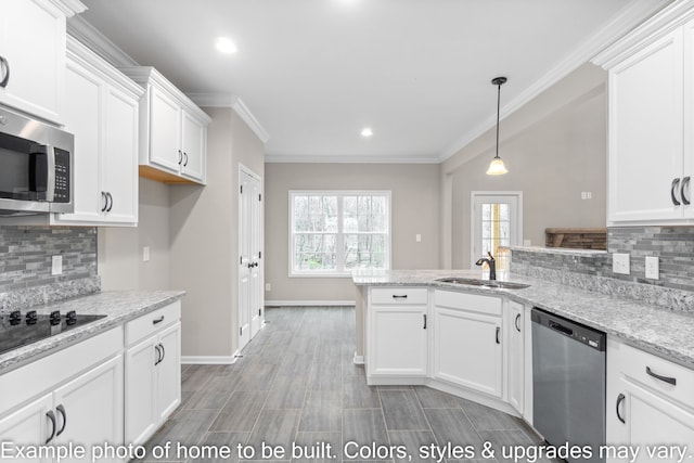 kitchen with stainless steel appliances, white cabinetry, and light stone counters