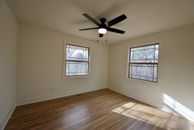 unfurnished room featuring wood-type flooring and ceiling fan