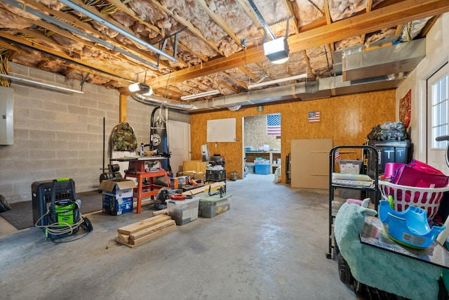 garage featuring electric panel and a garage door opener