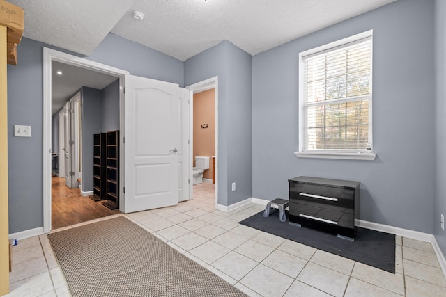 interior space featuring a textured ceiling