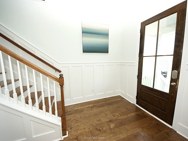 foyer entrance with dark hardwood / wood-style floors