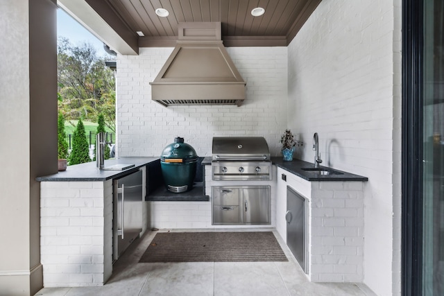 view of patio / terrace with a grill, area for grilling, and sink