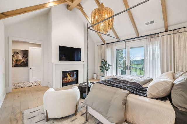 bedroom featuring high vaulted ceiling, beam ceiling, access to outside, and light hardwood / wood-style flooring