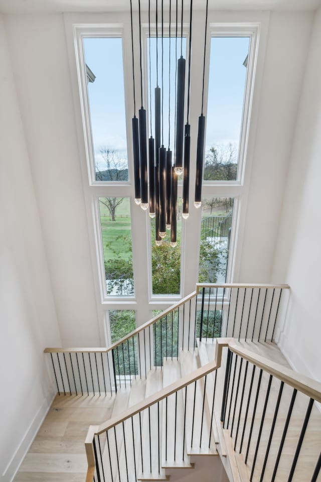 staircase with hardwood / wood-style flooring