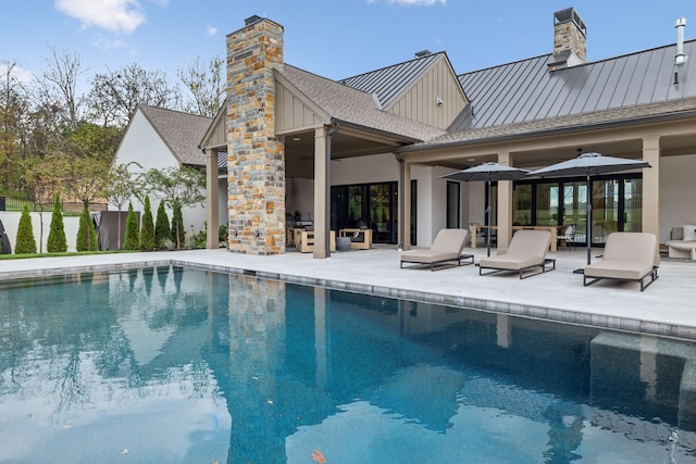 view of swimming pool with a patio area