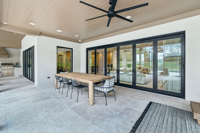 view of patio with area for grilling and ceiling fan