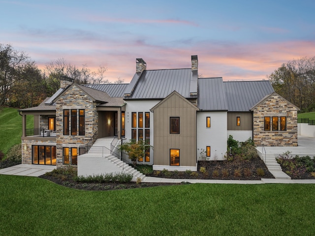 view of front of house with a yard