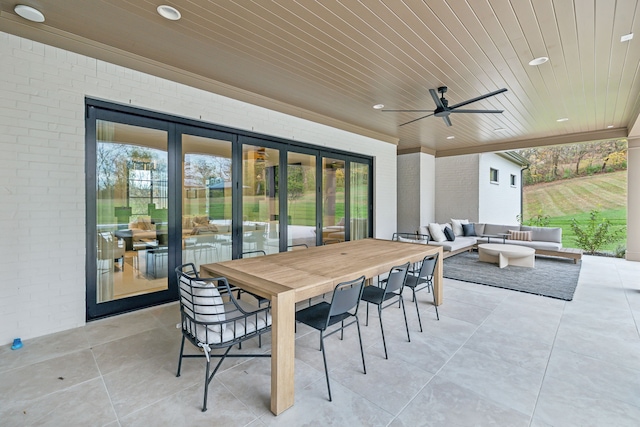 view of patio featuring an outdoor living space and ceiling fan