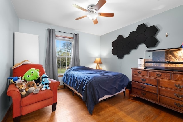 bedroom featuring light hardwood / wood-style flooring and ceiling fan