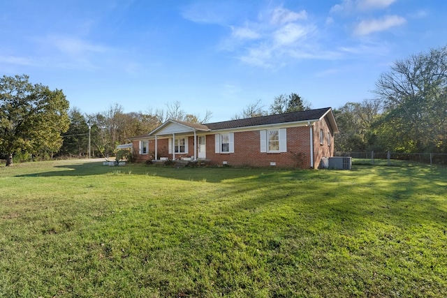 ranch-style house with central AC and a front lawn