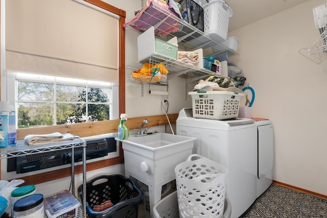 laundry area with washing machine and dryer and sink