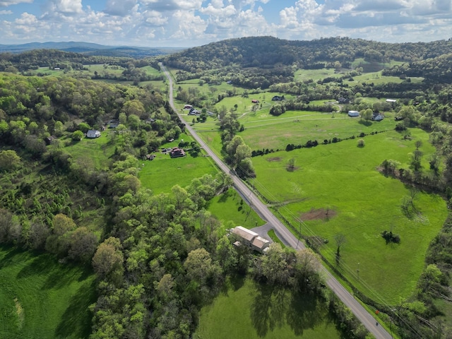 birds eye view of property featuring a mountain view and a rural view