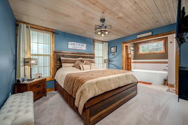 carpeted bedroom with multiple windows and wooden ceiling