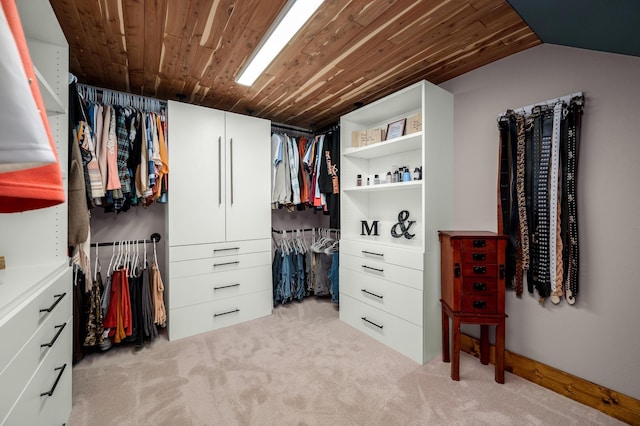 spacious closet with light carpet and lofted ceiling