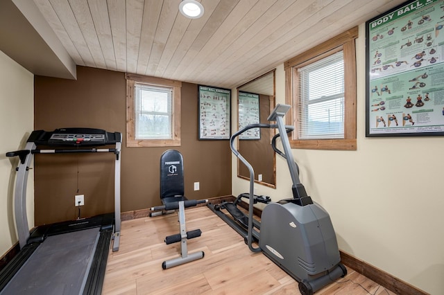 workout area featuring wooden ceiling and wood-type flooring