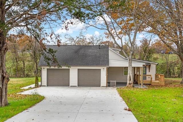 view of front of property with central AC, a garage, a front lawn, and a deck