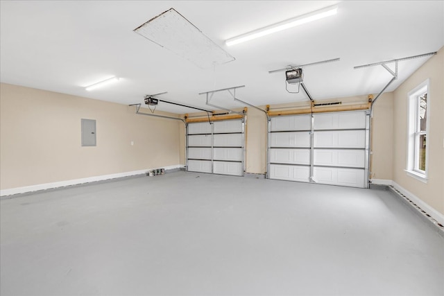 garage with electric panel and a garage door opener