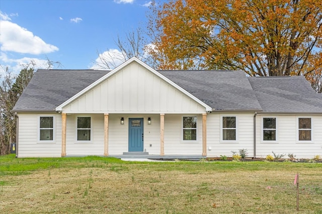 view of front of home with a front lawn and a porch