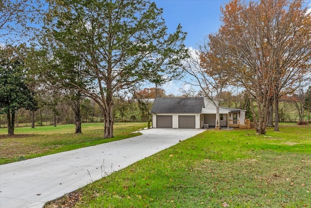 ranch-style house with a front yard and a garage