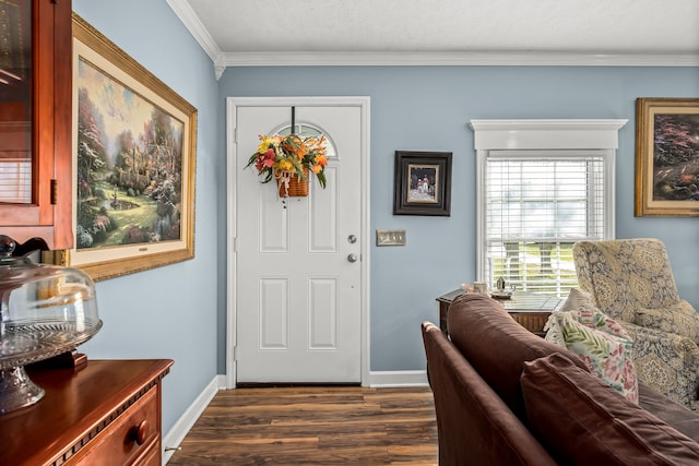 foyer entrance with dark wood-type flooring, a textured ceiling, and ornamental molding