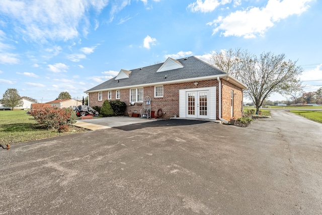 rear view of property with french doors