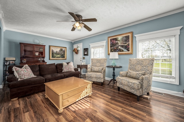 living room featuring a textured ceiling, dark hardwood / wood-style floors, ceiling fan, and crown molding