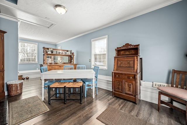 dining area with a textured ceiling, crown molding, and dark hardwood / wood-style floors