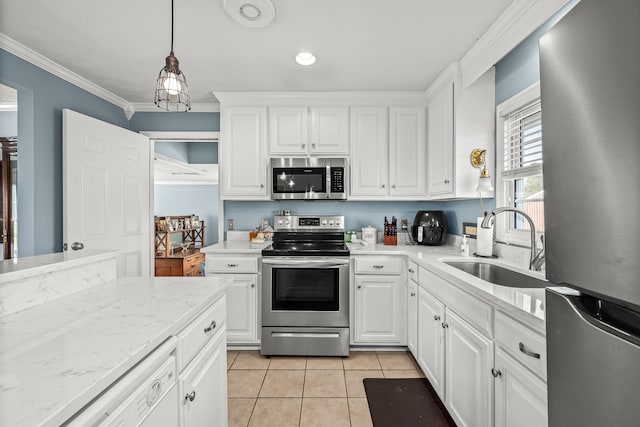 kitchen featuring sink, stainless steel appliances, decorative light fixtures, white cabinets, and ornamental molding