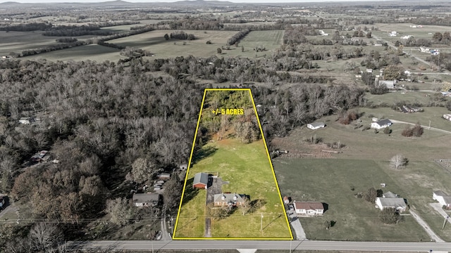 birds eye view of property featuring a rural view