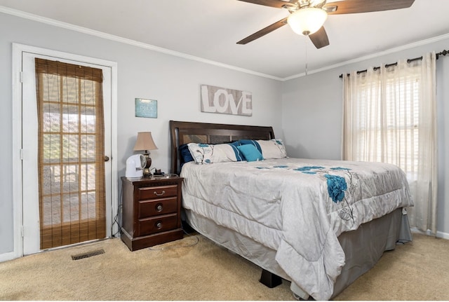 bedroom featuring light carpet, visible vents, ornamental molding, and ceiling fan