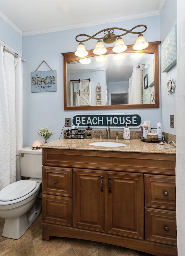 bathroom featuring crown molding, vanity, and toilet