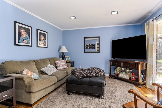 living room with crown molding and wood finished floors