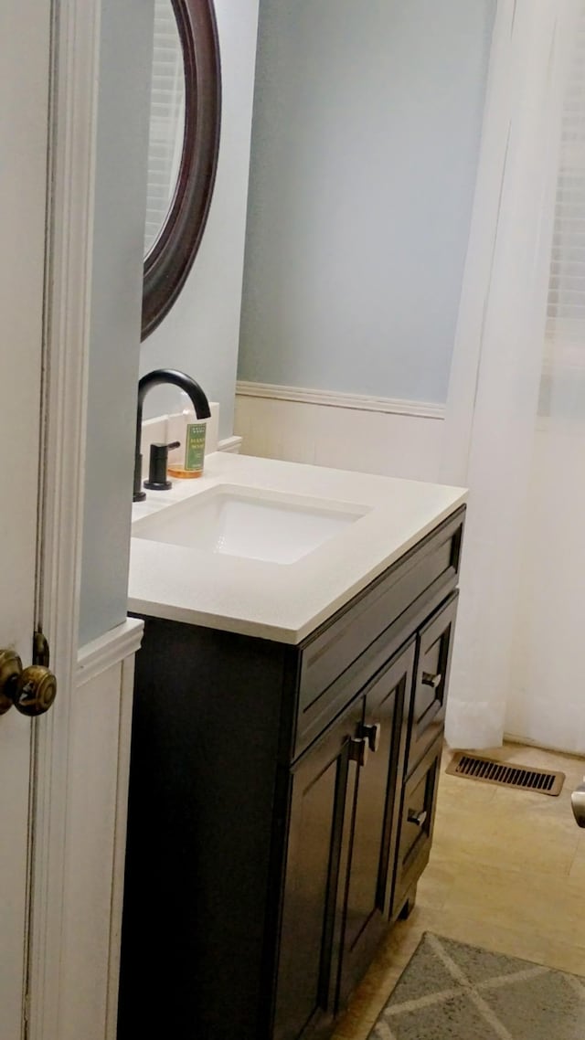 bathroom featuring visible vents and vanity