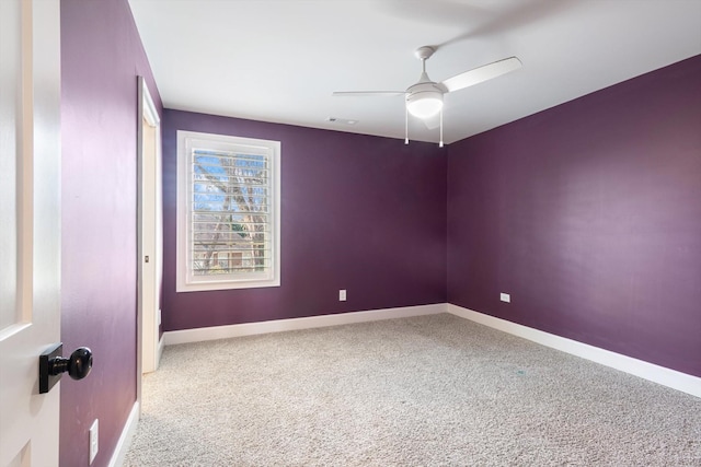 carpeted empty room with ceiling fan