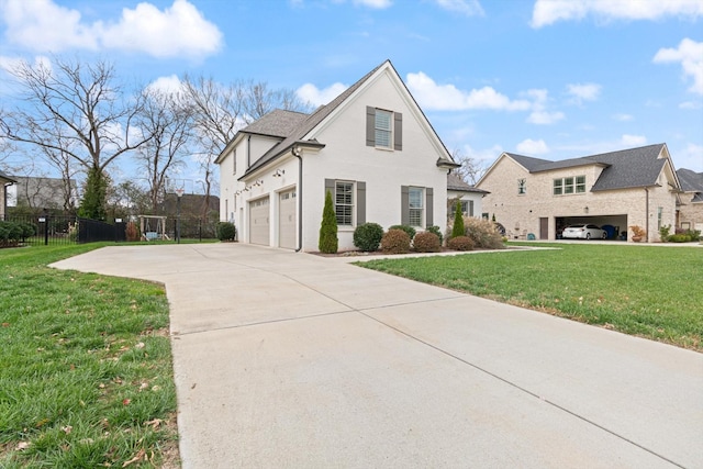 view of front of house with a garage and a front yard