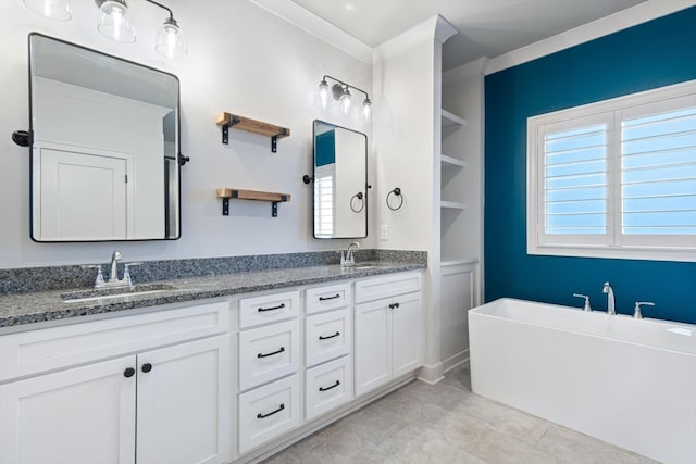 bathroom featuring a bath, vanity, and tile patterned floors