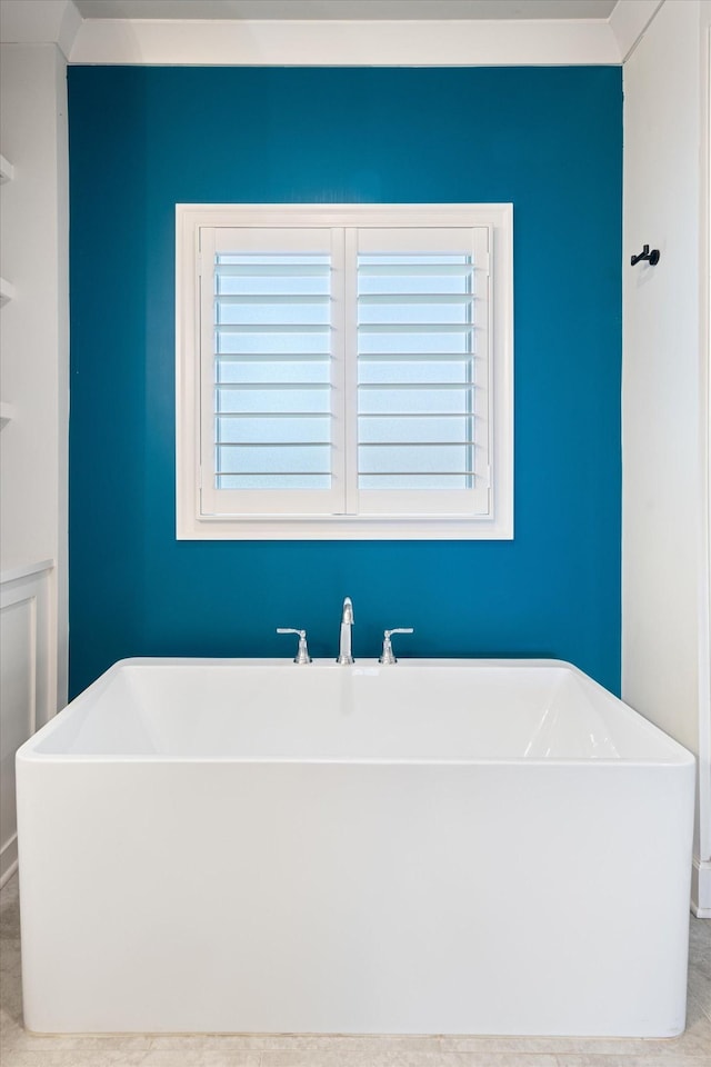 bathroom featuring tile patterned flooring and a bathing tub