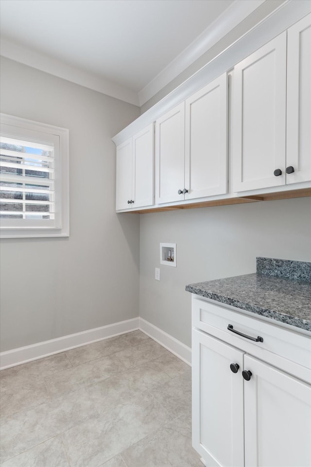 laundry room featuring cabinets, hookup for a washing machine, and ornamental molding