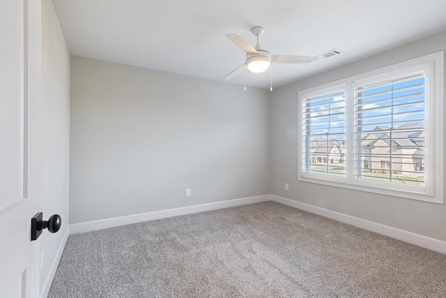 unfurnished room with carpet flooring and ceiling fan