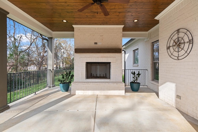 view of patio / terrace with an outdoor brick fireplace and ceiling fan