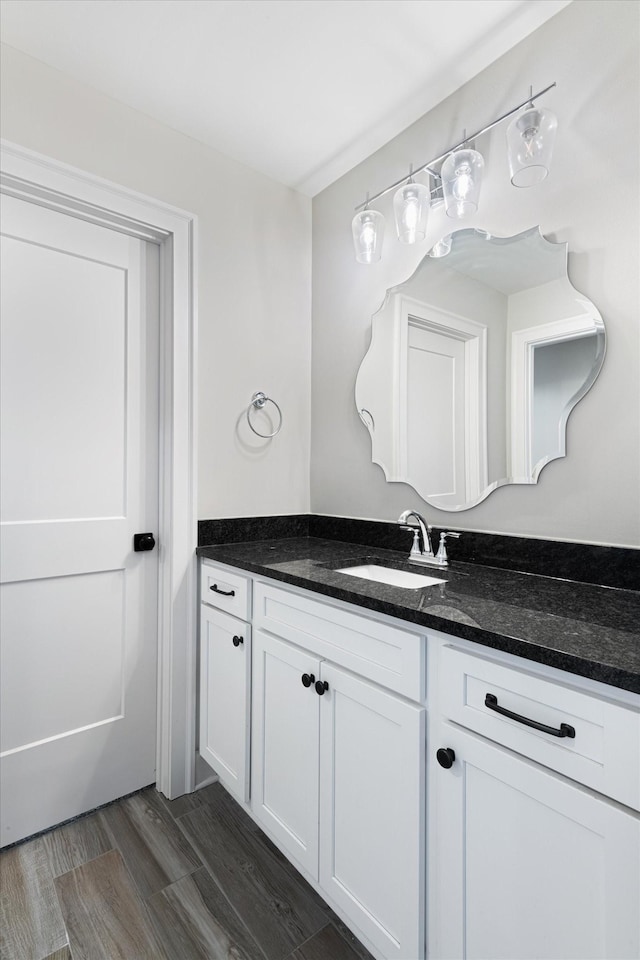 bathroom with hardwood / wood-style floors and vanity