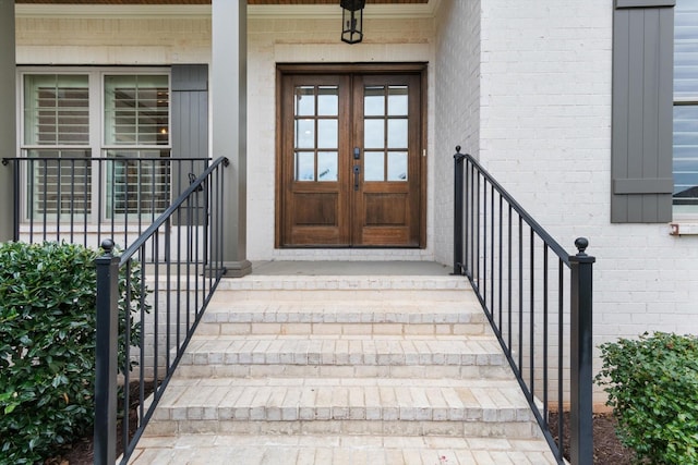 property entrance featuring french doors