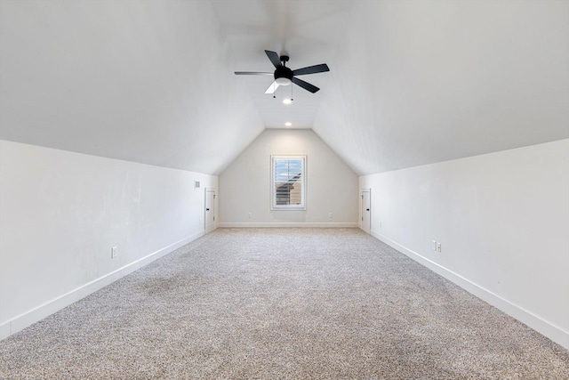 bonus room with ceiling fan, light colored carpet, and vaulted ceiling