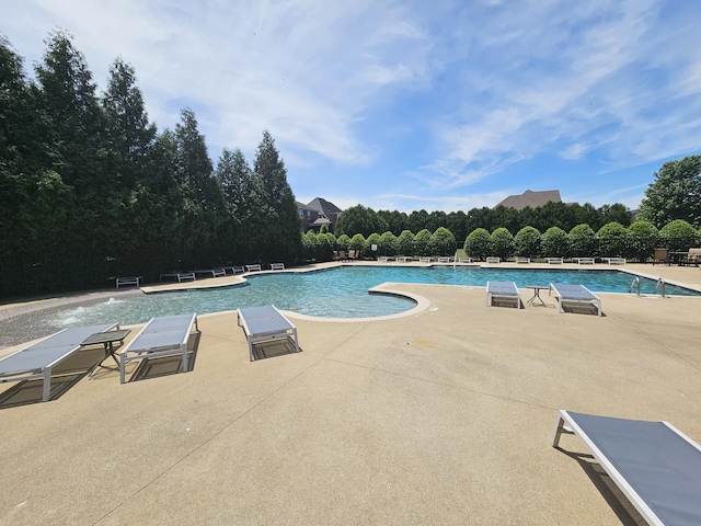 view of pool featuring a patio area and pool water feature